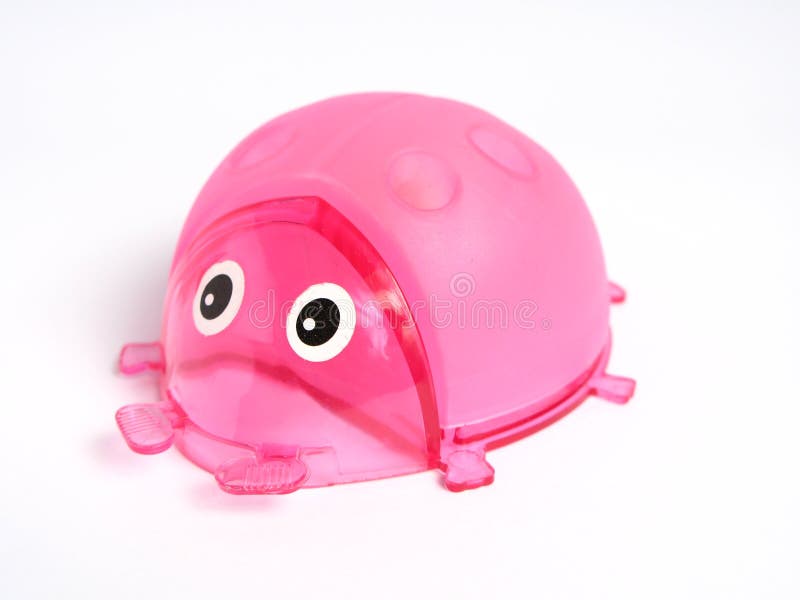 Support rose de crayon de coccinelle image libre de droits Support rose de crayon de coccinelle image libre de droits