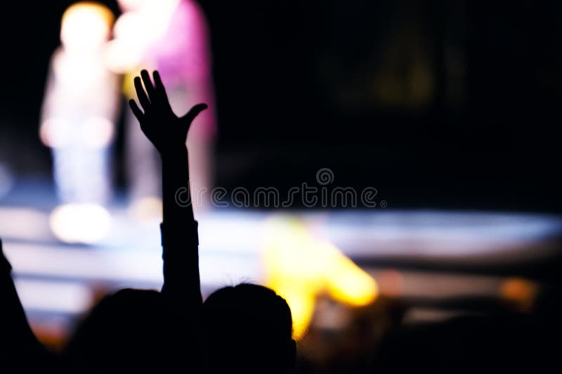 Supporter in the audience raising a hand royalty free stock photography Supporter in the audience raising a hand royalty free stock photography