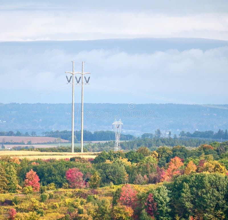 High tension electricity pylon and fall foliage