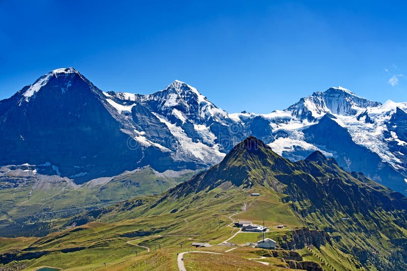 Mounts Eiger, Moench and Jungfrau in the Jungfrau region. Mounts Eiger, Moench and Jungfrau in the Jungfrau region