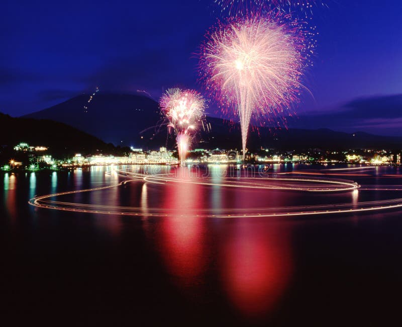 A brilliant display of Fireworks and their reflections in the water with Mount Fuji in the background. A brilliant display of Fireworks and their reflections in the water with Mount Fuji in the background