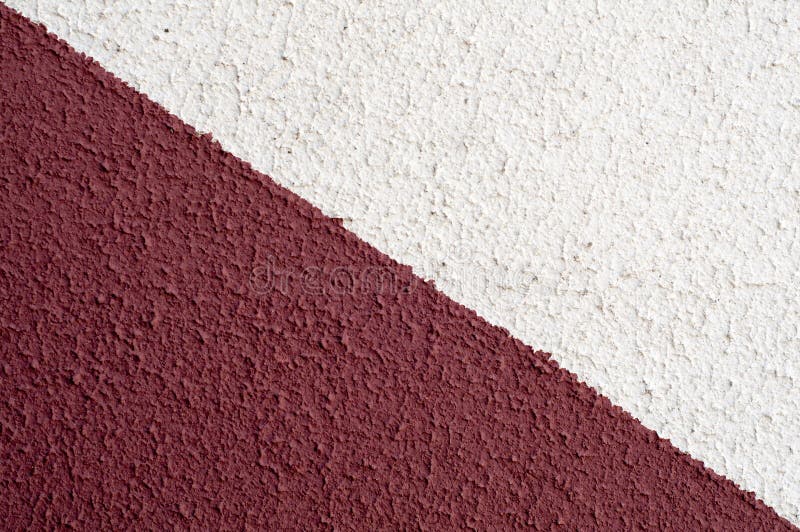 Suprafață de doi colorați, acoperind pereții texturați. fond abstract constă din două benzi pictate cu culori roșii și albe royalty free stock photography