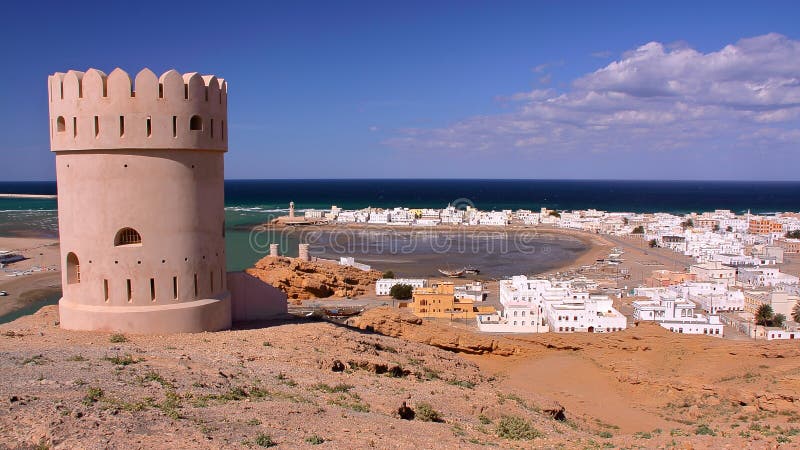 SUR, OMAN: General view of the beach of Ayjah with a watch tower in the foreground