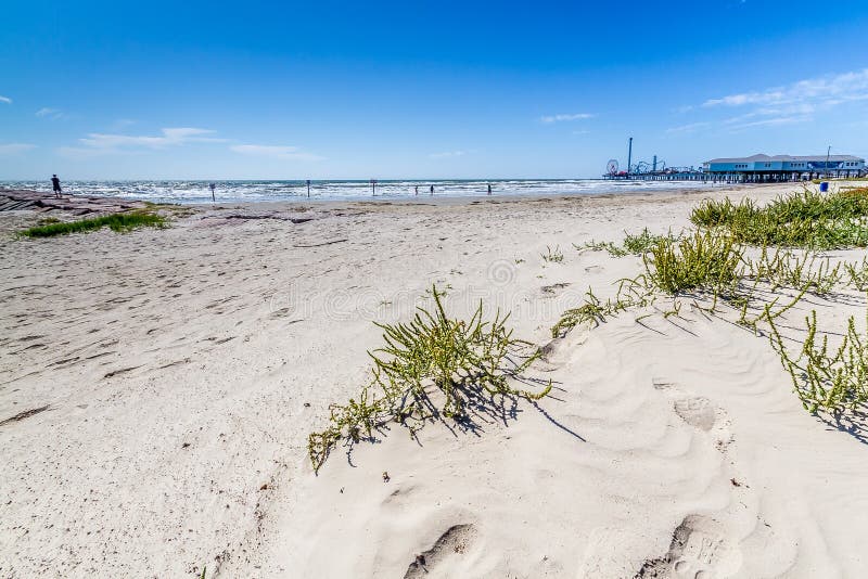 Surf and Sand of Galveston Beach with the Boardwalk in the Distance