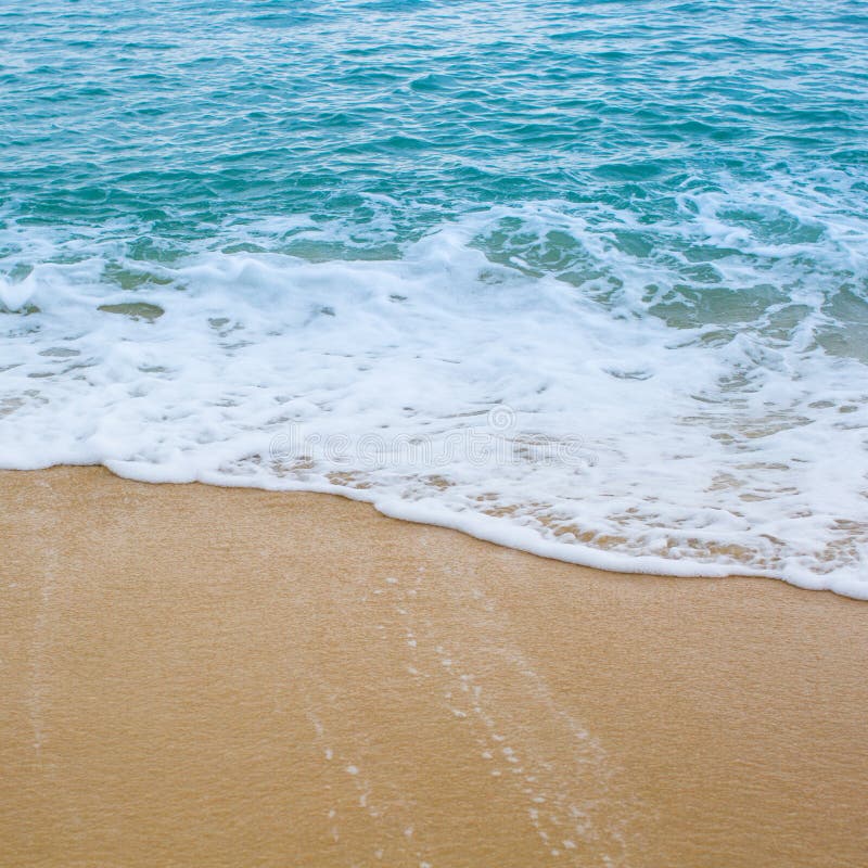 Surf wave is covering a sea beach sand royalty free stock photos Surf wave is covering a sea beach sand royalty free stock photos