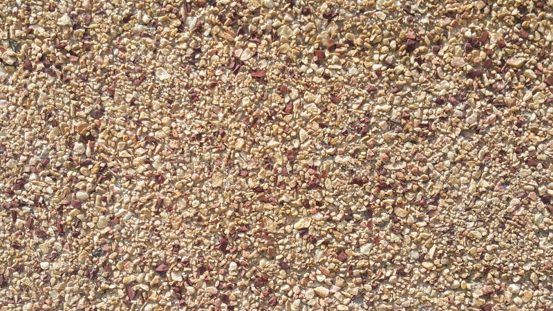 Surface structure created by spraying, sifted sand painted crimson and cream small stones royalty free stock images Surface structure created by spraying, sifted sand painted crimson and cream small stones royalty free stock images