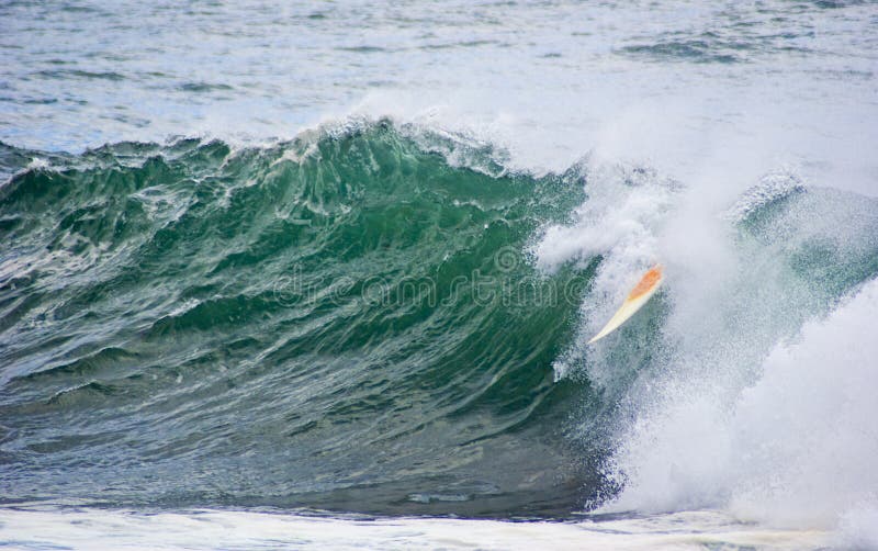 Surfboard dumped surf wave