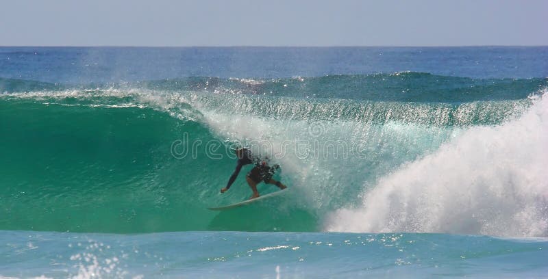 Surfer in the barrel. Wave at Byron bay. Blue ocean shot. Surfer in the barrel. Wave at Byron bay. Blue ocean shot.