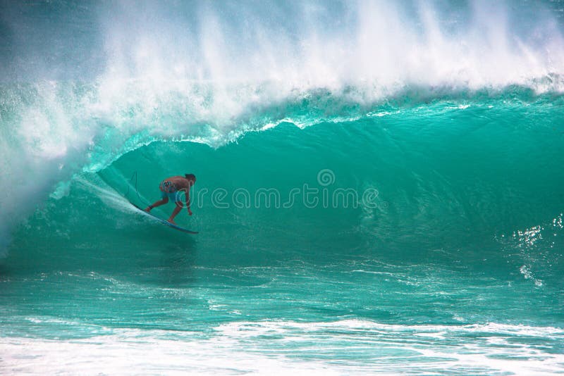 Surfer riding big wave in Bali stock photography Surfer riding big wave in Bali stock photography