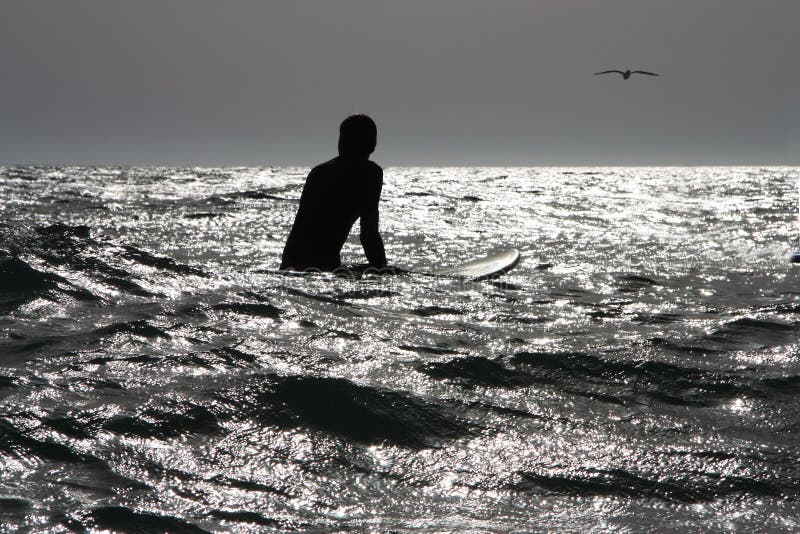 Surfer at sea