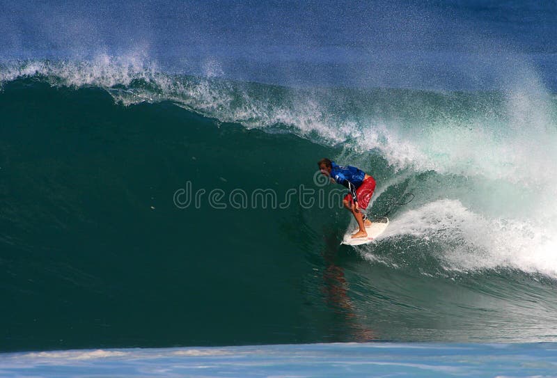 Photo of pro surfer, Shane Beschen, rides the tube of a wave during the Pipeline Masters surf contest, the third jewel of the Vans Triple Crown of Surfing in Hawaii. Photo of pro surfer, Shane Beschen, rides the tube of a wave during the Pipeline Masters surf contest, the third jewel of the Vans Triple Crown of Surfing in Hawaii.