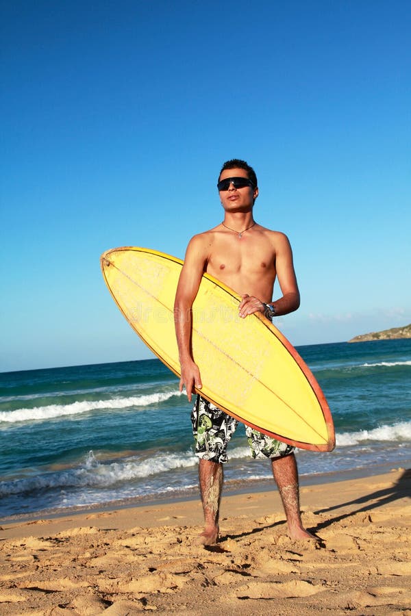 Surfer with a Surfboard on Beach Stock Photo Image of dude, male