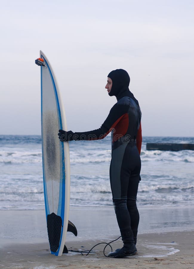 Surfer with Surfboard Standing in a Wetsuit Stock Photo Image of