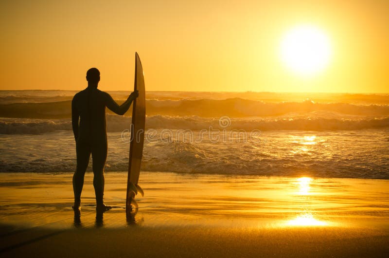 A Surfer Watching the Waves Stock Image - Image of sunset, health: 25086243