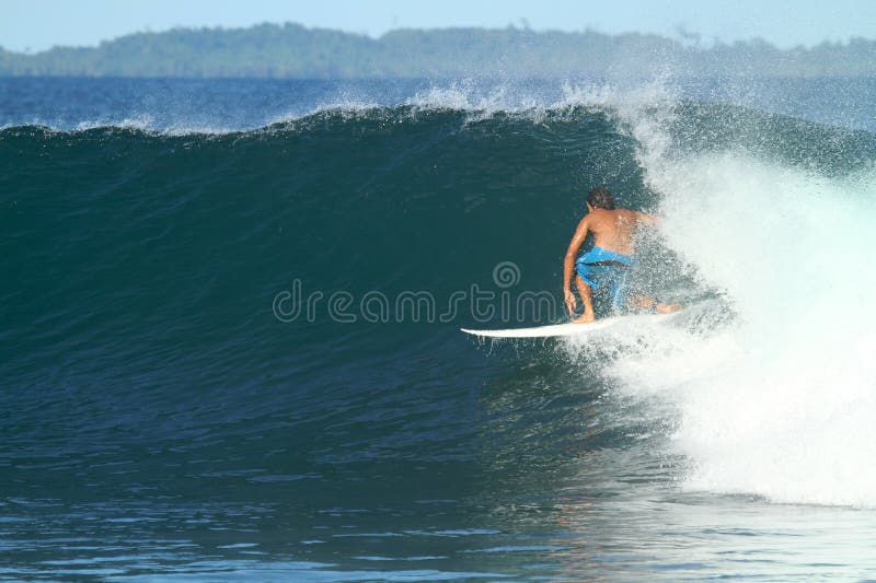 Surfer on wave, Indonesia