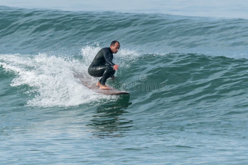 Surfing the waves stock photo. Image of rider, surfboard 140484742