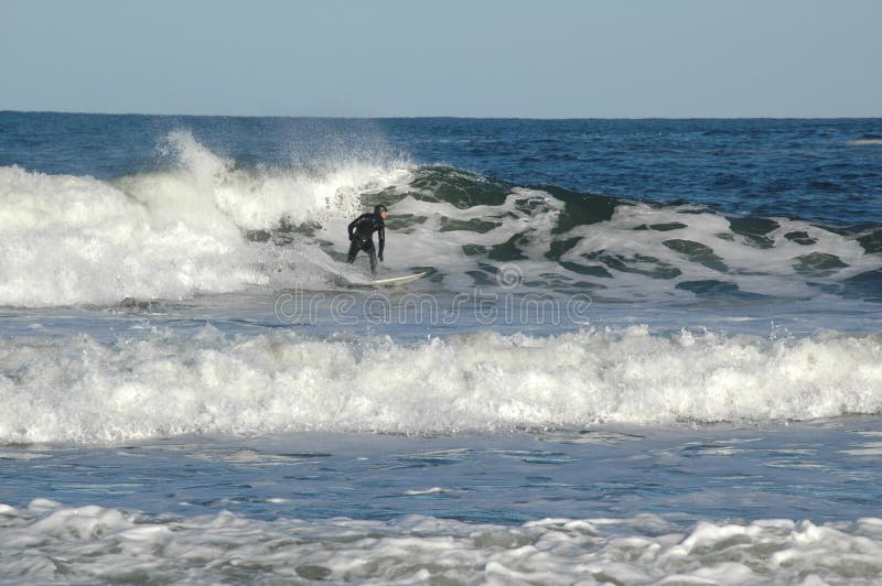 Surfer riding the waves on the Atlantic coast. Surfer riding the waves on the Atlantic coast