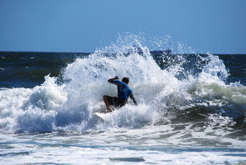 Surfer in a wave with splash. Surfer in a wave with splash