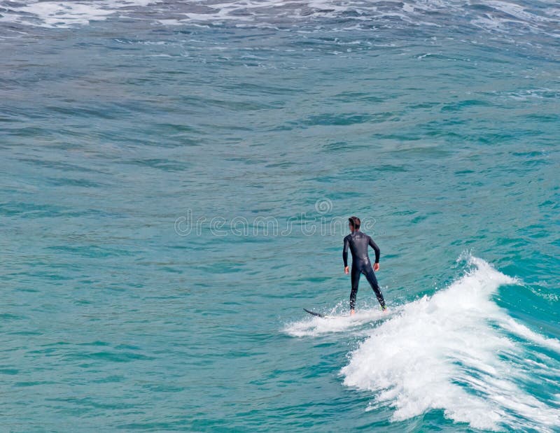 Surfer riding a wave in Sardinia. Surfer riding a wave in Sardinia