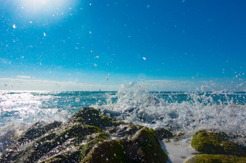 A surge of surf waves on a rocky shore