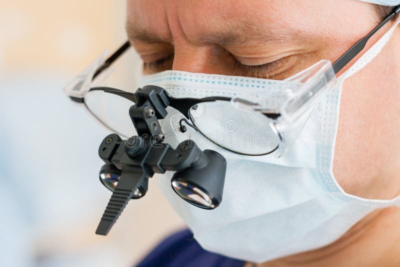 Surgeon With Binocular Glasses Stock Photo Image of profession, face