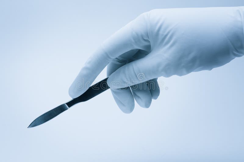 Surgeon hand with scalpel stock photo. Image of care 18130864