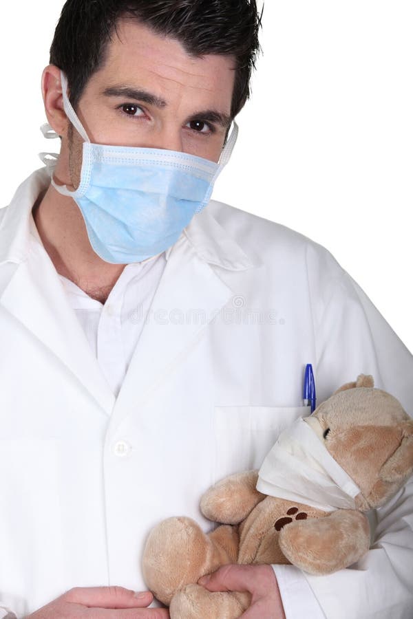 Surgeon healing teddy bear stock photography