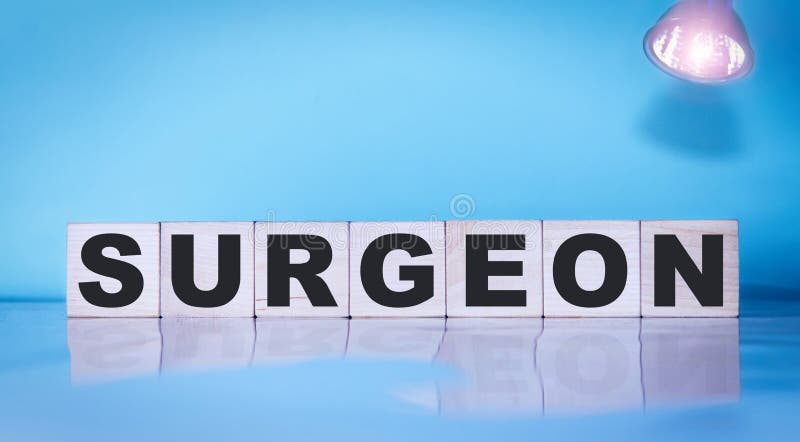 Surgeon inscription on wooden cubes on a blue background. Medical concept stock photo