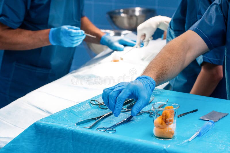 Surgeon Taking a Scissors from Tray Stock Photo Image of scrubs
