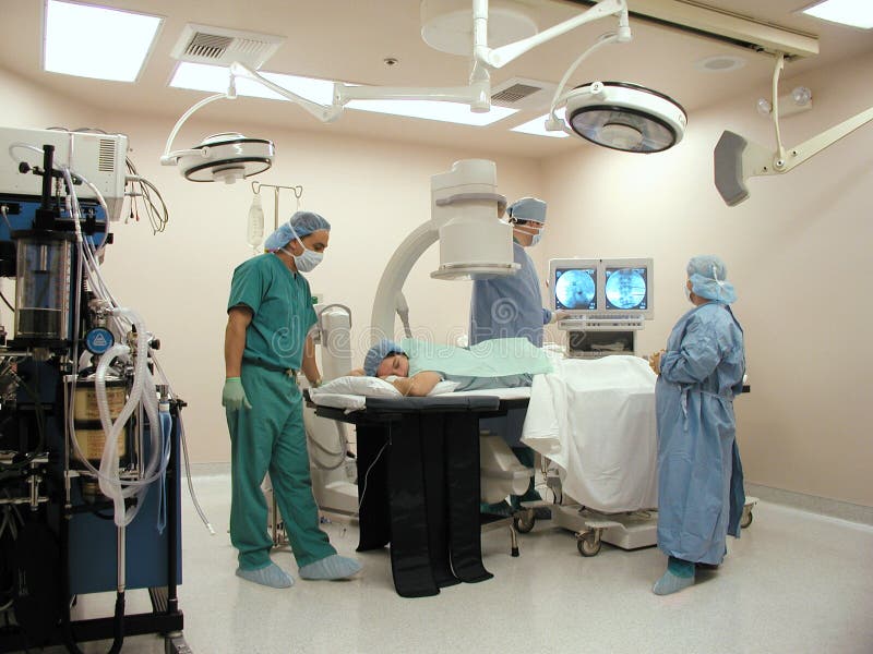 Surgeons With C Arm In Operating Room Stock Photo Image of health