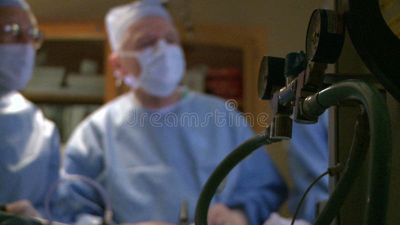 Surgical team performing laparoscopic procedure (5 of 7)