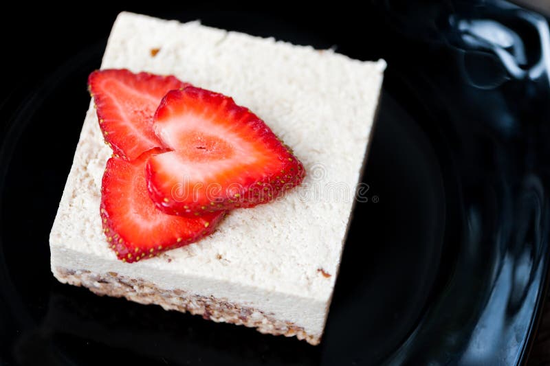 Raw vegan cheese cake with strawberries. Raw vegan cheese cake with strawberries