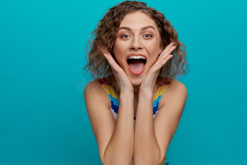 Happy Model With Curly Hair Looking At Camera Smiling Stock Image