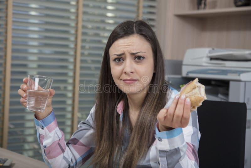 Surprised business woman eats a meal royalty free stock photos Surprised business woman eats a meal royalty free stock photos