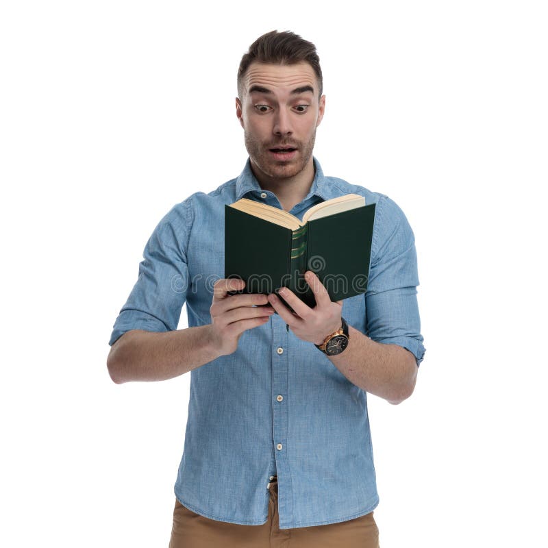 Surprised casual reading book and gasping royalty free stock photo