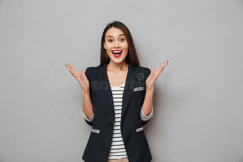 Surprised Cheerful asian business woman looking at the camera stock photo Surprised Cheerful asian business woman looking at the camera stock photo