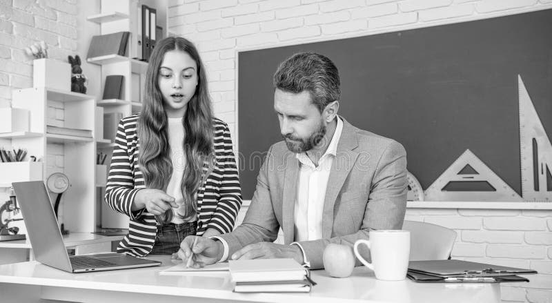 Surprised child study in classroom with teacher stock photos