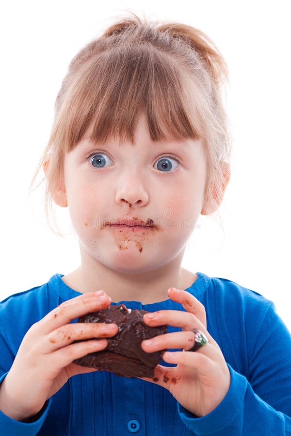 Surprised girl dirty with chocolate cake