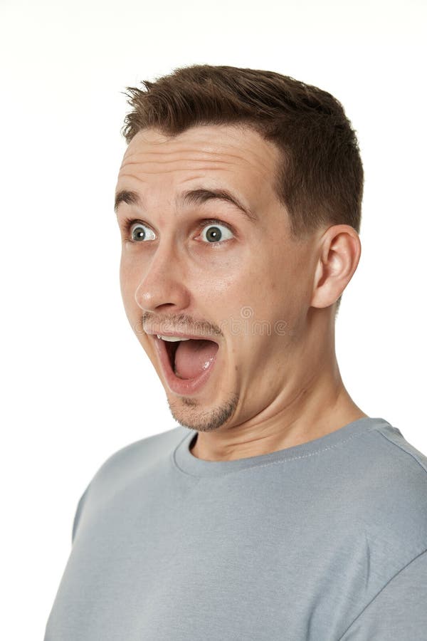 surprised guy looking at camera on white background royalty free stock photography