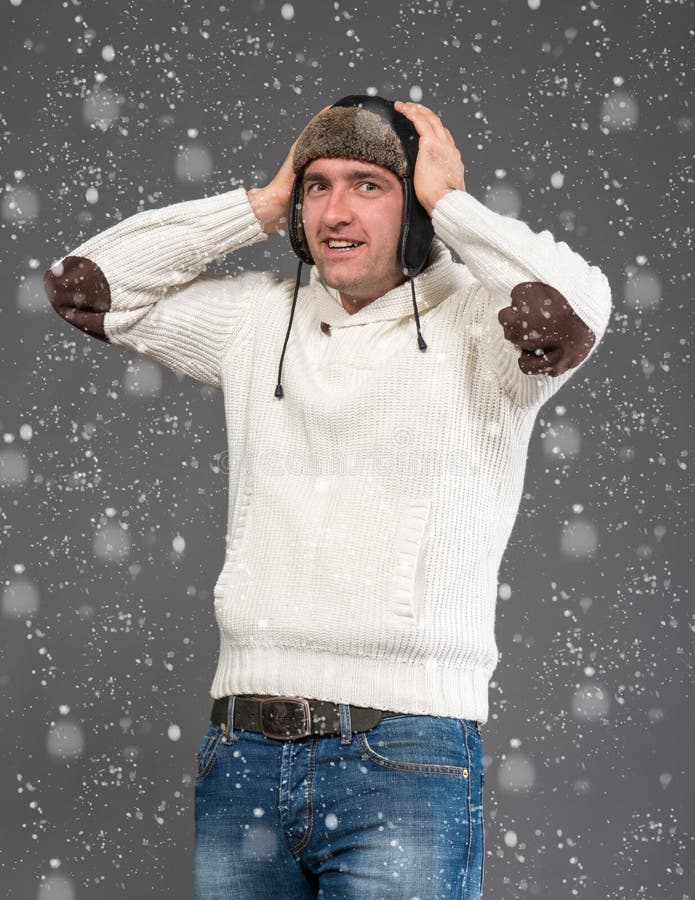 Surprised handsome man in winter hat