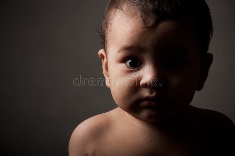 Surprised indian baby boy in pose