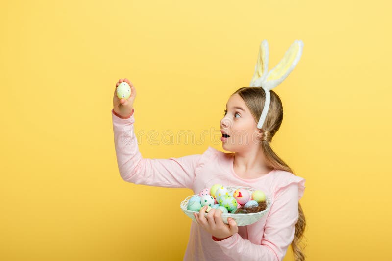 Surprised kid with bunny ears looking