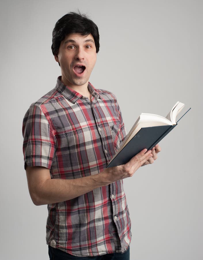 Surprised man with book