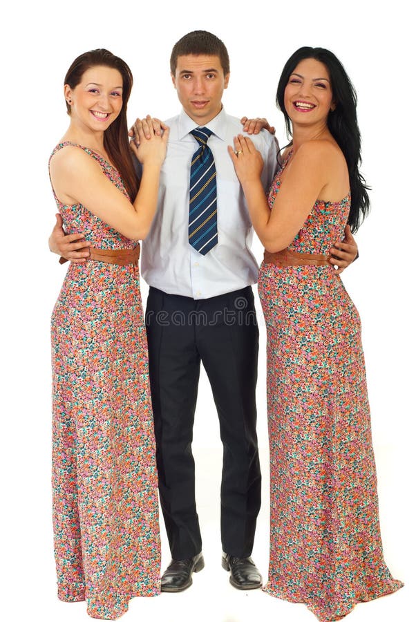 Surprised man holding two laughing women stock photo Surprised man holding two laughing women stock photo