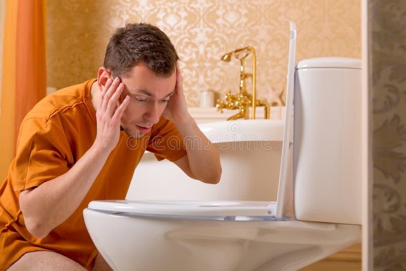 Surprised Man Looking Inside the Toilet Bowl Stock Image Image of