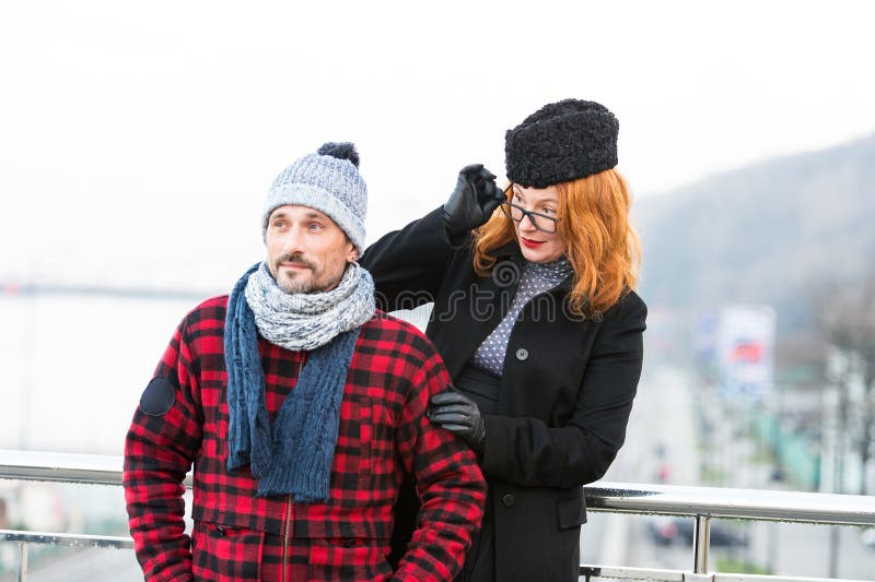 Surprised red hair woman in glasses looked at stranger on bridge. Woman look over the glasses from the man back. stock photos Surprised red hair woman in glasses looked at stranger on bridge. Woman look over the glasses from the man back. stock photos