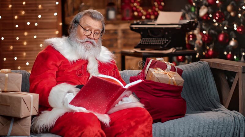 Surprised Santa Claus opening wishlist book reading wishes. Shot on RED Raven 4k Cinema Camera