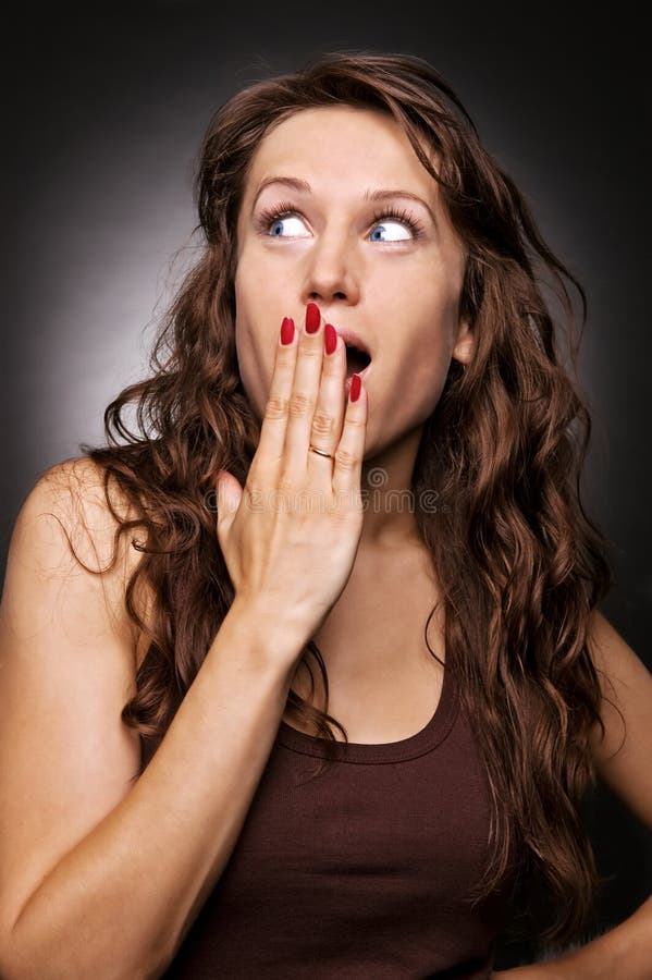 Surprised woman with blue eyes stock photos
