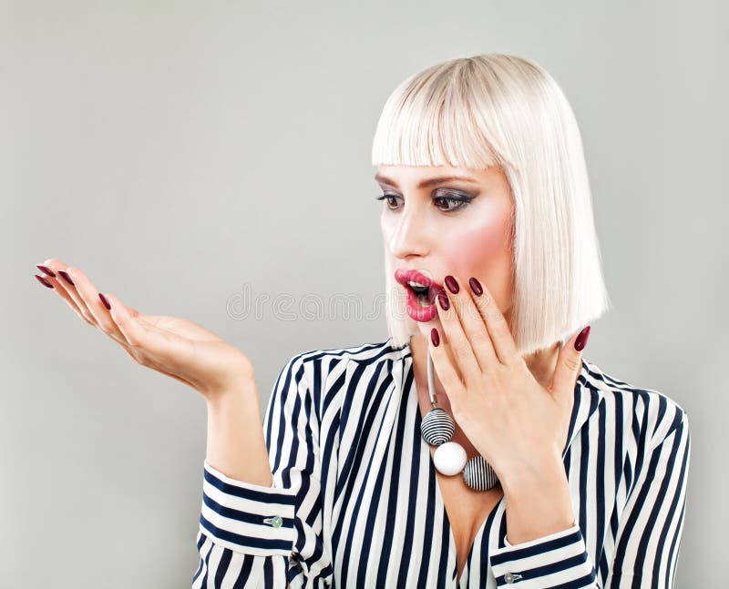 Surprised Woman Showing Empty Copy Space on the Open Hand