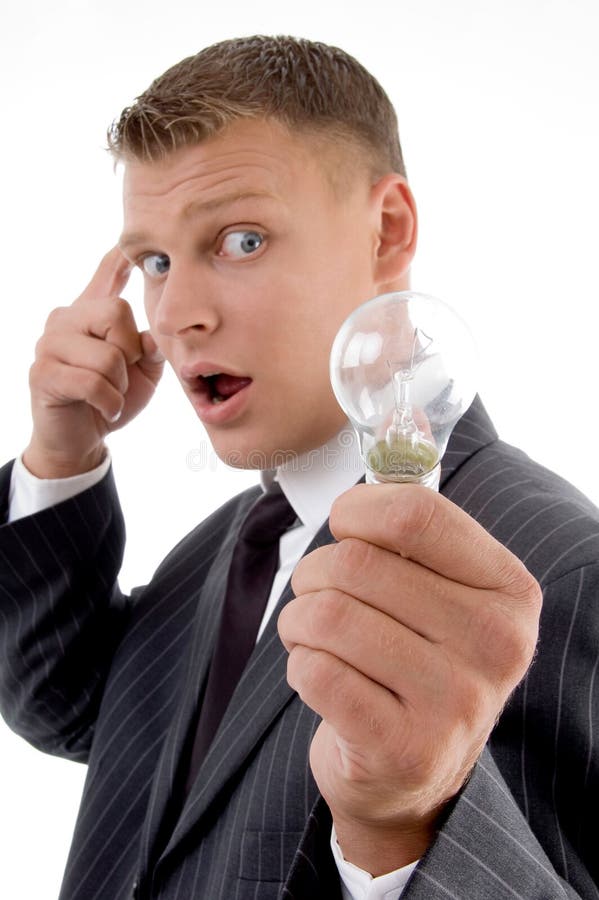 Surprised young man holding electric bulb